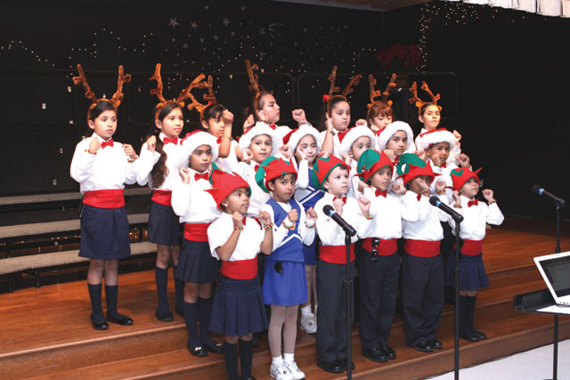 Dr. CM Cash Elementary School choir students are seen performing during a Christmas concert held at the campus on Tuesday, Dec. 18. Parents also participated as well as school cheerleaders. (Photos by T.J. Tijerina)