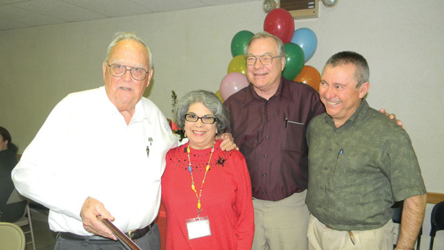 Dr. Cecil Simmons, Gloria Gonzalez, RN, Dr. William H. Heins and Dr. Rafael Lopez are seen (from l-r) at Gonzalez’ retirement party at San Benito Medical Associates on Friday, Dec. 21. (Staff photo by Robert Perez)
