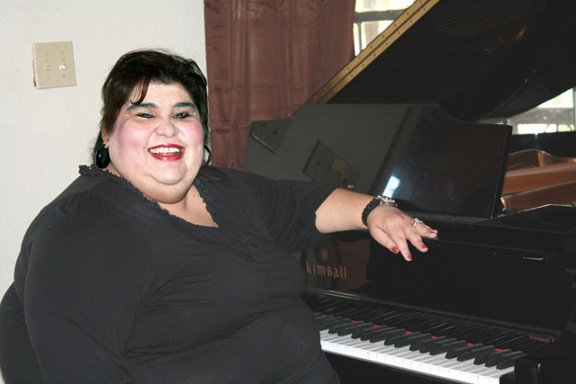 Lupita Abrego of the First Presbyterian Church of San Benito is seen sitting at her piano. She will be performing at a recital Saturday, Dec. 15, at 2 p.m. (Courtesy photo)