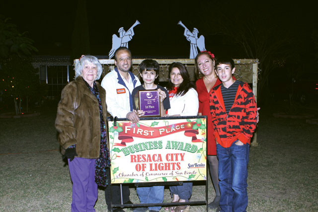 Rodriguez Income Tax in San Benito was awarded first place in the Pride Lights Contest by the San Benito Pride Committee. Seen are Bertha Wilison of the Pride Committee, Mr. and Mrs. Rodriguez and their son Philip, Debbie Layton of the Pride Committee and Derrick Layton. (Photos by T.J. Tijerina)