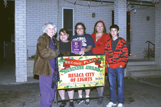 Velma’s Hair Illusions in San Benito was awarded second place in the Pride Lights Contest by the San Benito Pride Committee. Seen are Bertha Wilson of the Pride Committee, Velma Trevino and her daughter Crystafina, Debbie Layton of the Pride Committee and Derrick Layton. (Photos by T.J. Tijerina)