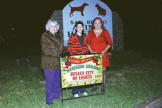 San Benito Animal Hospital in San Benito was awarded third place in the Pride Lights Contest by the San Benito Pride Committee. Seen are Bertha Wilson of the Pride Committee, and Derrick and Debbie Layton of the Pride Committee. (Photos by T.J. Tijerina)