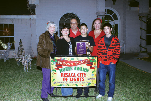 The Contreras home, on Easy St., was awarded second place in the Pride Lights Contest by the San Benito Pride Committee. Seen are Bertha Wilson of the Pride Committee, Mr. and Mrs. Contreras and their grandson Chris, and Debbie Layton of the Pride Committee and Derrick Layton. (Photos by T.J. Tijerina)