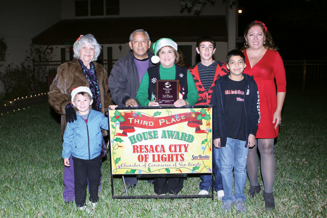 The Saldana home was awarded third place in the Pride Lights Contest by the San Benito Pride Committee. Seen are Colton Saldana, Bertha Wilson of the Pride Committee, Mr. and Mrs. Saldana, Derrick Layton, Aydam Saldana, and Debbie Layton of the Pride Committee. (Photos by T.J. Tijerina)