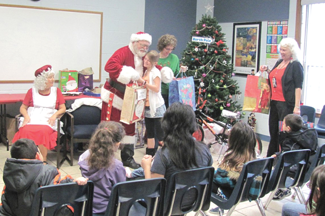 Santa Claus and Mrs. Claus are seen visiting the Sunny Glen Children's Home in San Benito last year. (Courtesy photo)