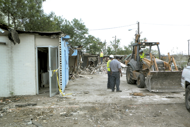 City of San Benito employees are pictured working on the demolition of the former San Benito Police Department on Reagan Street Tuesday afternoon. The project is part of the revitalization of San Benito, in which buildings that city officials said have outlived their usage are demolished or refurbished, according to Code Enforcement Director John Rodriguez. (Staff photo by Francisco E. Jimenez)