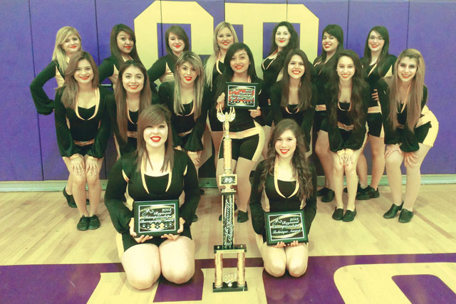 The San Benito High School Belles are seen inside the SBHS gymnasium Friday with the trophy and prizes they earned at a recent competition. (Staff photo by Michael Rodriguez)