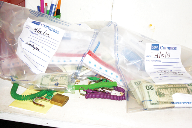 The money seen (above) was seized at the Lucky Place Arcade in Harlingen, an eight-liner establishment that was one of five raided Saturday during Operation Bishop. Shown (below) is the estimated $56,322 seized in all five raids but does not include seized ATMs that had not been processed. (Cameron County DA photos)
