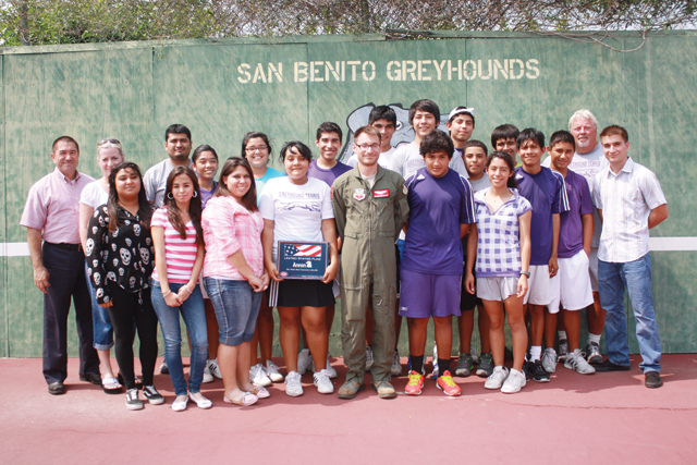 Air Force Senior Airman Matthew Sanchez is seen shaking hands with San Benito High School Tennis Coach Dan Hirst as his team looks on. Sanchez visited with the team at the high school tennis court on Thursday to express his appreciation for the athletes sending him a care package and personalized letters. Those shown with the airman in the group photo include (top row, left to right) his father and SBHS Assistant Principal Henry Sanchez, Vicky Sanchez (Matthew’s mother), Assist. Coach Jose Torres, Catalina Hernandez, Cristina Estrella, Christopher Perez, Marco Vega, Esteban Casas, Ivan Prado, Daniel Garcia, Gabriel Mendez, Victor Guerrero, Fernando Garcia, Hirst and Nicholas Sanchez (Mathew’s brother). At bottom (left to right), Elise Garcia, Melissa De Los Santos, Astrid Gonzalez, Brittany Mendez, Matthew Sanchez, David Mendoza and Elizabeth Medina are seen. (Photos by Francisco E. Jimenez and Cecilia Gonzales)
