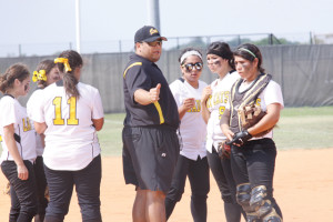 Rio Hondo Lady Bobcats softball coach Brett Esparza is seen giving instructions to his team. Coach Esparza along with Athletic Director Rocky James recently expressed their support of the San Benito Lady Greyhounds in their bid for a state championship this weekend. (Photo by T.J. Tijerina)
