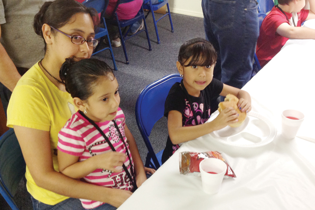San Benito News photos by Francisco E. Jimenez Children participating in the First Baptist Church-Rio Hondo Vacation Bible School are seen enjoying a first-day meal on Monday, when activities kicked off.