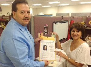 San Benito News photo by Michael Rodriguez Angela G. Leal Elementary School Principal Manuel Cruz is seen with Mari Gonzales of San Benito CISD Migrant Programs Department on Monday. Cruz and Gonzales were two of many SBCISD employees who have donated to the family of Emelia “Emily” Martinez, the 17-year-old San Benito High School incoming senior who died tragically in an auto-pedestrian accident on Thursday, June 27. 