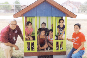 Courtesy photo Members of the Boys and Girls Club of San Benito are seen Wednesday inside a playhouse built by cadets of the Cameron County Juvenile Justice Department Home Construction Program. Seen with the kids are CCJJD Chief Executive Officer Tommy Ramirez along with the club’s Interim Chief Professional Officer, Veronica Cantu.