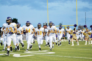 San Benito News photo by Francisco E. Jimenez The San Benito Greyhounds are seen running onto the field at the onset of their matchup against the PSJA Memorial Wolverins in Pharr on Friday.