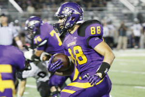 Photo by T.J. Tijerina San Benito Greyhound wide receiver Manuel Sanchez, a senior, is seen looking for running room at Bobby Morrow Stadium on Friday against the Weslaco East Wildcats.