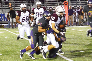 San Benito News photo by Francisco E. Jimenez San Benito Greyhound defensive back Nate Mireles helps make a tackle against the PSJA Bears Friday at Bobby Morrow Stadium.