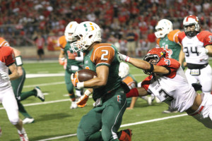 Photo by T.J. Tijerina Junior free safety Elijah Deleon of the Harlingen Cardinals dives for a tackle against the Harlingen South Hawks Friday at Boggus Stadium. The Cards edged the Hawks by a score of 21-14 to take sole possession of first place in District 32-5A.