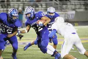 Photo by T.J. Tijerina Port Isabel Tarpons senior running back Juan Aguilera is seen looking for room to run against the Raymondville Bearkats in San Benito on Friday.
