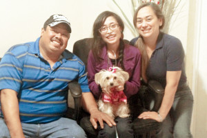 Photo by Christina R. Garza Janet Mata and her Yorkshire Terrier Mei-Ling are seen with Janet’s parents, Hortencia and Reynaldo Mata, inside their San Benito home on Thursday.