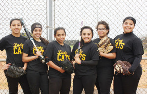(Photo by Heather Cathleen Cox) The Rio Hondo Lady Bobcats, who along with coach Brett Esparza are pictured here, sit atop District 32-3A varsity softball play in what’s amounted to another stellar season.