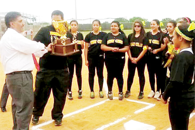 (RHISD photo) The Rio Hondo Lady Bobcats are continuing to make school softball history after securing a two-game sweep over Zapata in the bi-district round of the playoffs, earning themselves a trip to Alice for a second round date with Carrizo Springs in a best of three series scheduled at 7:30 p.m. Friday, 5 p.m. Saturday and, if necessary, a third game 30 minutes following game two. Pictured are the Lady Bobcats receiving the District 32-3A championship trophy from Rio Hondo ISD Superintendent Ismael Garcia.