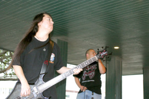 (Staff photo by Ray Quiroga) Recent drowning victim Kean Koite, the ex-bassist for local cover band Ten Yearz Gone, was remembered by his sister Nellie Koite Gara and bandmate Adrian Gonzalez as a “fun-loving” and kind person. Kean is seen on the bass in this 2008 photo while Adrian takes the lead on vocals.