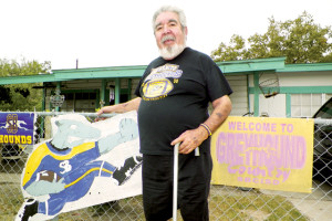 (Staff photo by Michael Rodriguez) The late Ramiro Sauceda, a longtime fan of Greyhound and Lady ’Hound sports, is seen outside his San Benito home in 2012. Ramiro also participated in the 2013 San Benito News Hooked on ’Hounds fan contest, in which he gained more than 14,000 votes.