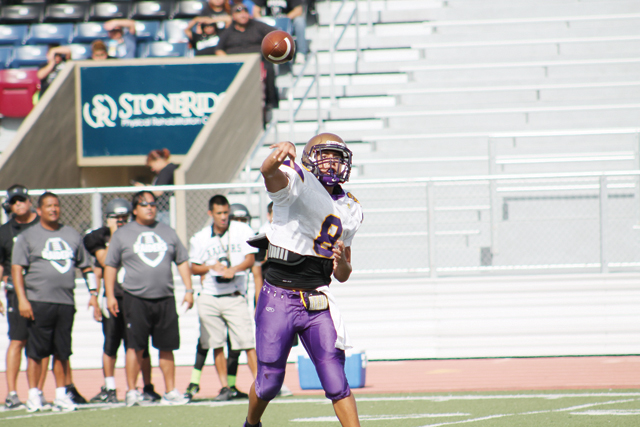 (Photo by Edward Cruz) San Benito Greyhounds signal-caller Cristian Sierra is pictured during mid-pass at Friday morning’s scrimmage action against PSJA North.