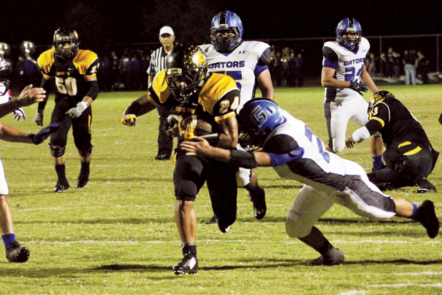 (Photo by Edward Cruz) Rio Hondo Bobcats running back Marco Garate is seen running through the Grulla Gators defense with ease on Friday night at Bobcat Stadium.