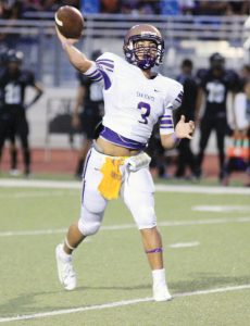 (Staff photo by Ray Quiroga) San Benito Greyhound quarterback Cristian Sierra is seen launching a pass on Thursday against Weslaco East at Bobby Lackey Stadium.